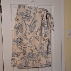 Cynthia Rowley New York sz L, cream wrap skirt with pale blue and brown floral.